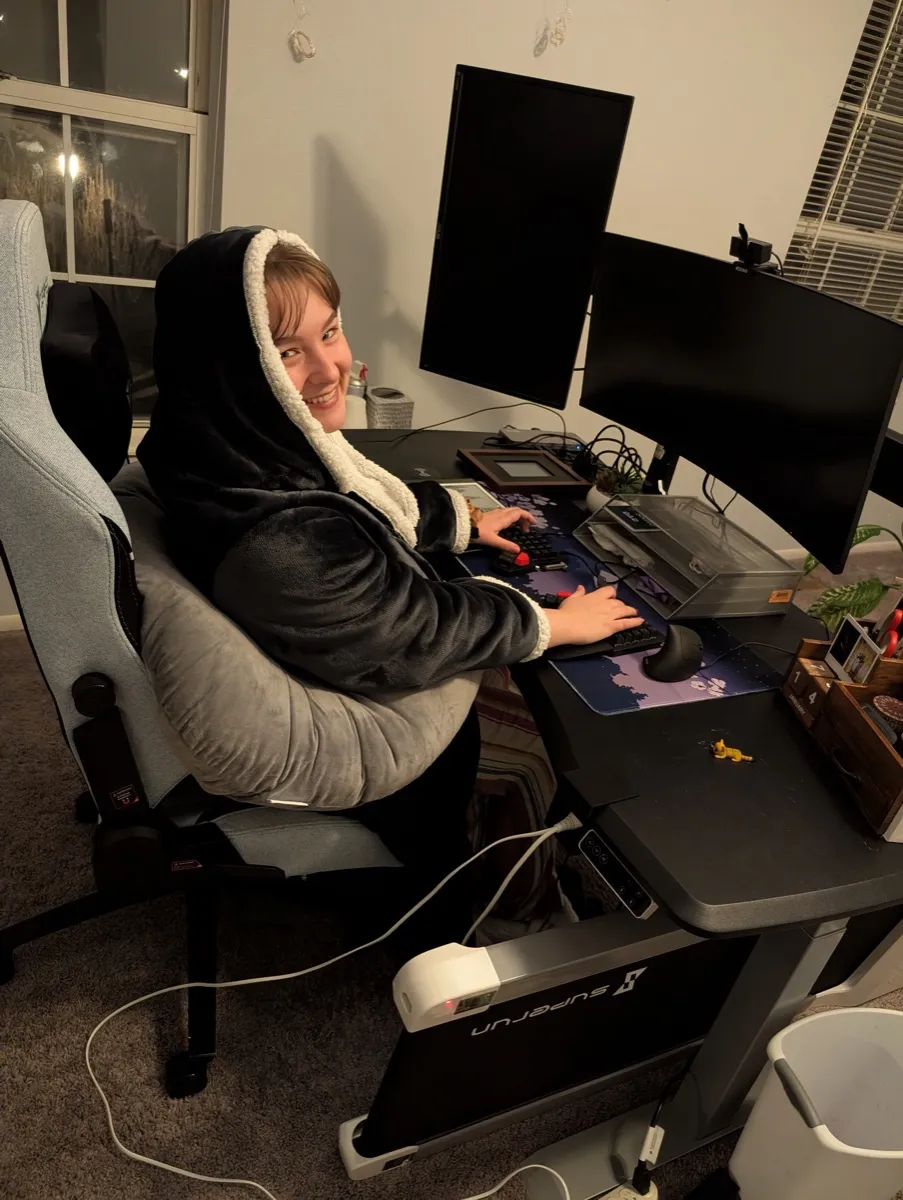 My wife in her heated blanket hoodie at her desk