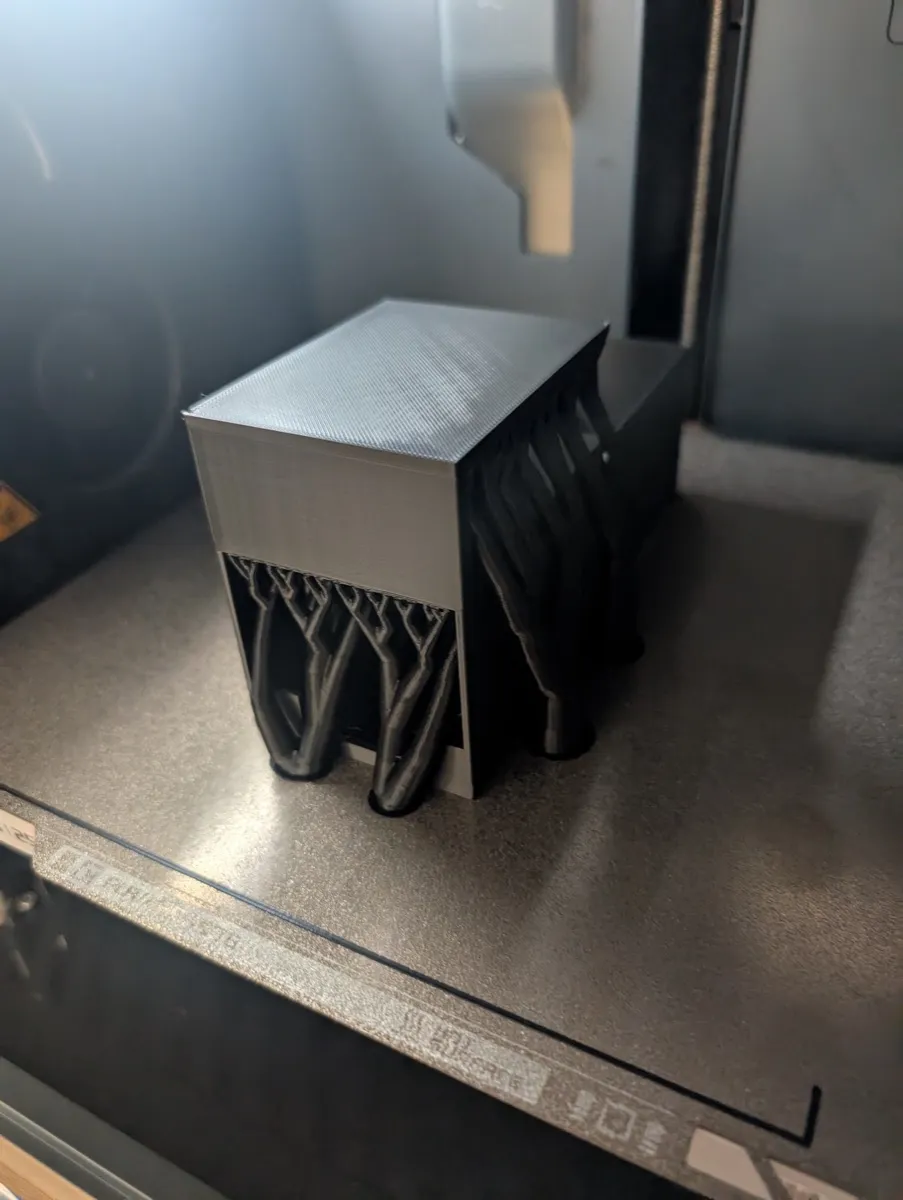 The finished print on the bed with tree supports